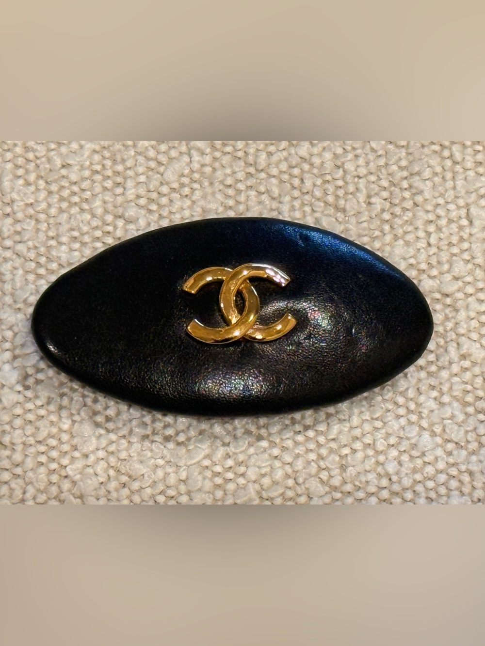CHANEL Black Leather Oval Barrette with Gold CC Emblem